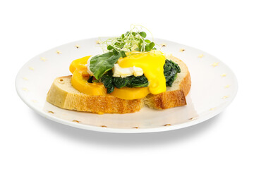 Plate of tasty sandwich with florentine egg on white background