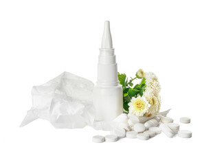 Bottle with drops, flowers and used tissue on white background