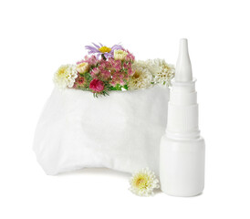 Bottle with drops, flowers and respirator on white background