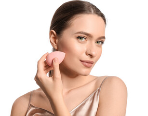 Beautiful young woman with makeup sponge on white background
