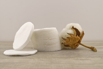 Cotton stem boll and stack of facial cotton pads