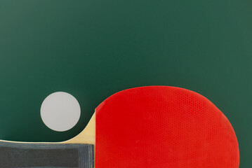 Table tennis equipment on green background