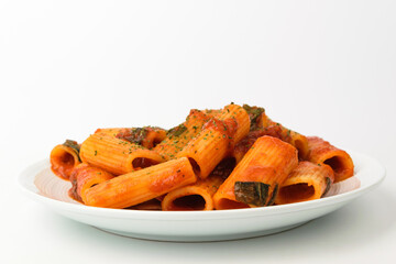 Rigatoni pasta on white background
