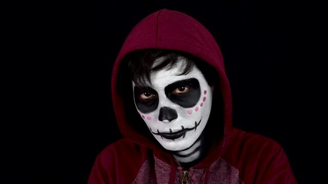 male model with skull makeup. Day of the death, Mexico. 