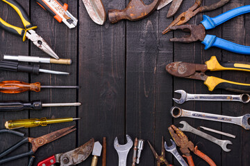 Hand tools and equipment are placed on the wooden floor with copy space for designing text - top view