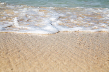 Movement of the sea wave on the beach with sand. Can use for add text and abstract background.