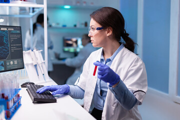 Professional doctor scientist taking a sample for medical experiment. Chemist researcher working in...