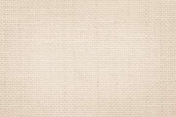 Jute hessian sackcloth canvas woven texture pattern background in light beige cream brown color blank empty