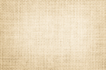 Jute hessian sackcloth canvas woven texture pattern background in light beige cream brown color blank empty