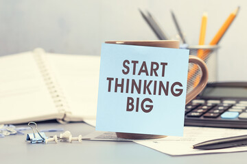 Start thinking BIG - concept of text on sticky note