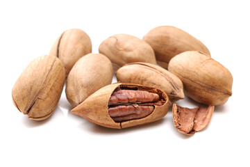 Peeled pecan nuts closeup, isolated on white background
