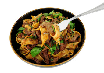 Steak ragu with pappardelle pasta isolated on a white background