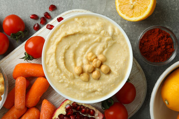 Concept of cooking hummus on gray background, top view