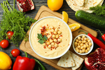 Concept of cooking hummus on wooden background