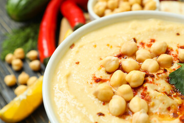 Concept of cooking hummus on wooden table, close up