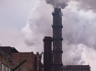 A dirty environment. Smoke emission from factory pipes. Mining and production of metal in Ukraine. 