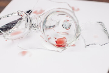 broken wine glass on a plate kitchenware wooden table