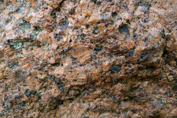 Close-up on a red stone. Texture, background.