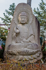 Seated Buddha carved in rock at Manbulsa Temple in Yeongcheon, South Korea.