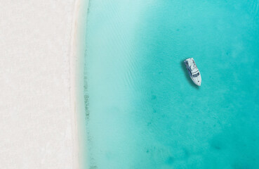 Drone photo of beach in Sapodilla Bay, Providenciales, Turks and caicos, boat by itself