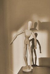 wooden mannequin on the table