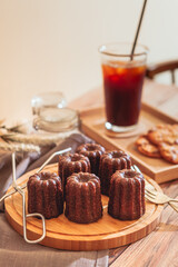 Coffee and canelé are on the table.