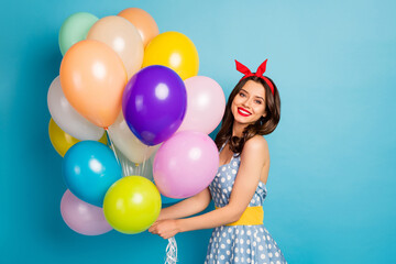 Fototapeta na wymiar Portrait of her she nice attractive lovely pretty lovable glamorous cheerful cheery girl holding in hands bunch air balls isolated on bright vivid shine vibrant blue color background