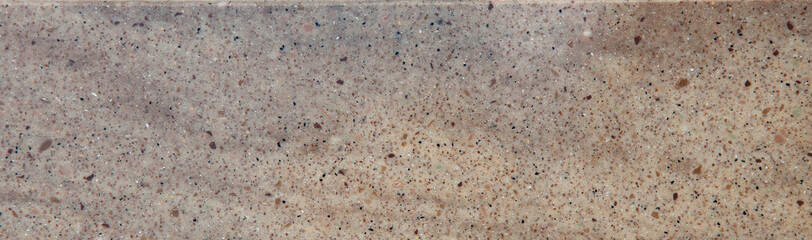 Texture of decorative artificial acrylic stone. Stone sample for bathroom, kitchen countertops furniture. Stone texture for modern interior design.