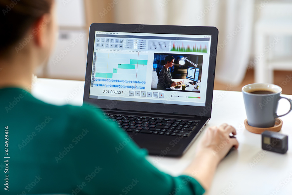 Poster technology, post production and vlog concept - close up of woman working in video editor program on 
