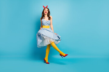 Full length body size view of her she nice attractive lovely fashionable glamorous cheerful cheery wavy-haired girl dancing having fun isolated on bright vivid shine vibrant blue color background