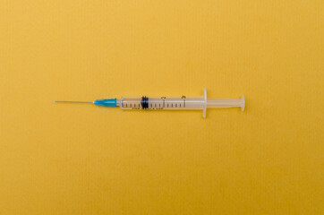 Medical plastic syringe for injection and vaccination on paper background