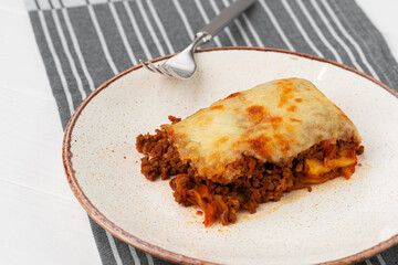 Piece of fresh meat lasagna with cheese