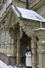 Porch door of wooden house with ornamental windows, carved frames of merchant Sapozhnikov on...