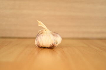  whole white garlic on wooden floor background