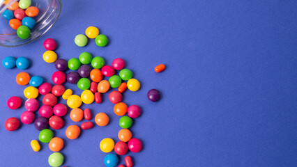 colorful little candies on a colored background