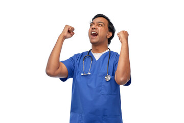 healthcare, profession and medicine concept - happy smiling indian doctor or male nurse in blue uniform celebrating success over white background