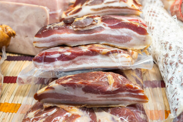 cold-boiled pork wrapped in transparent plastic sold at local city farmers market