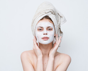woman with bare shoulders face mask clean skin care