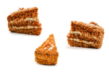 Peace of honey cake isolated on white background.
