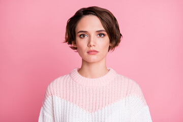 Fototapeta premium Photo portrait of serious woman isolated on pastel pink colored background