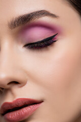 Naklejka premium close up of woman with pink eye shadows isolated on grey