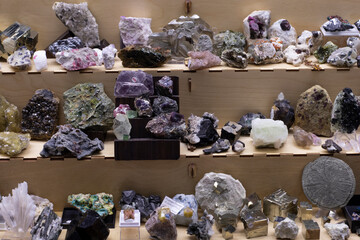 colored stones of different sizes lying on a shelf in a store in daylight. Fair, Good Buy, Loot. Sorting. 07 February 2020, Russia, St. Petersburg, local shop, exhibition of semi-precious stones