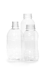 three different empty plastic bottles isolated on white background. production of new containers