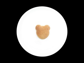 Homemade Bear face shaped cookie on a white plate