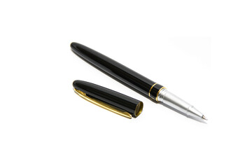 Ballpoint pen isolated on white background. The handle is open, the cap is next to the handle.