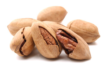 Peeled pecan nuts closeup, isolated on white background
