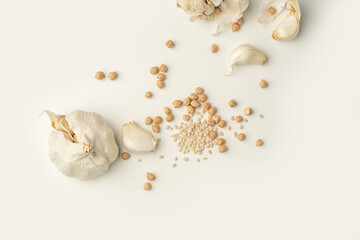 the white power food garlic and chick peas as high key photography on a white background. with copy space perfect for illustrations