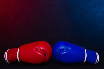 Boxing gloves Red and Blue hitting together poster design.