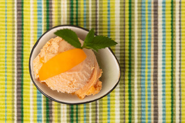 scoop of homemade apricot ice cream from above