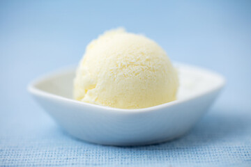 Fototapeta na wymiar Simple scoop of homemade vanilla ice cream in bowls